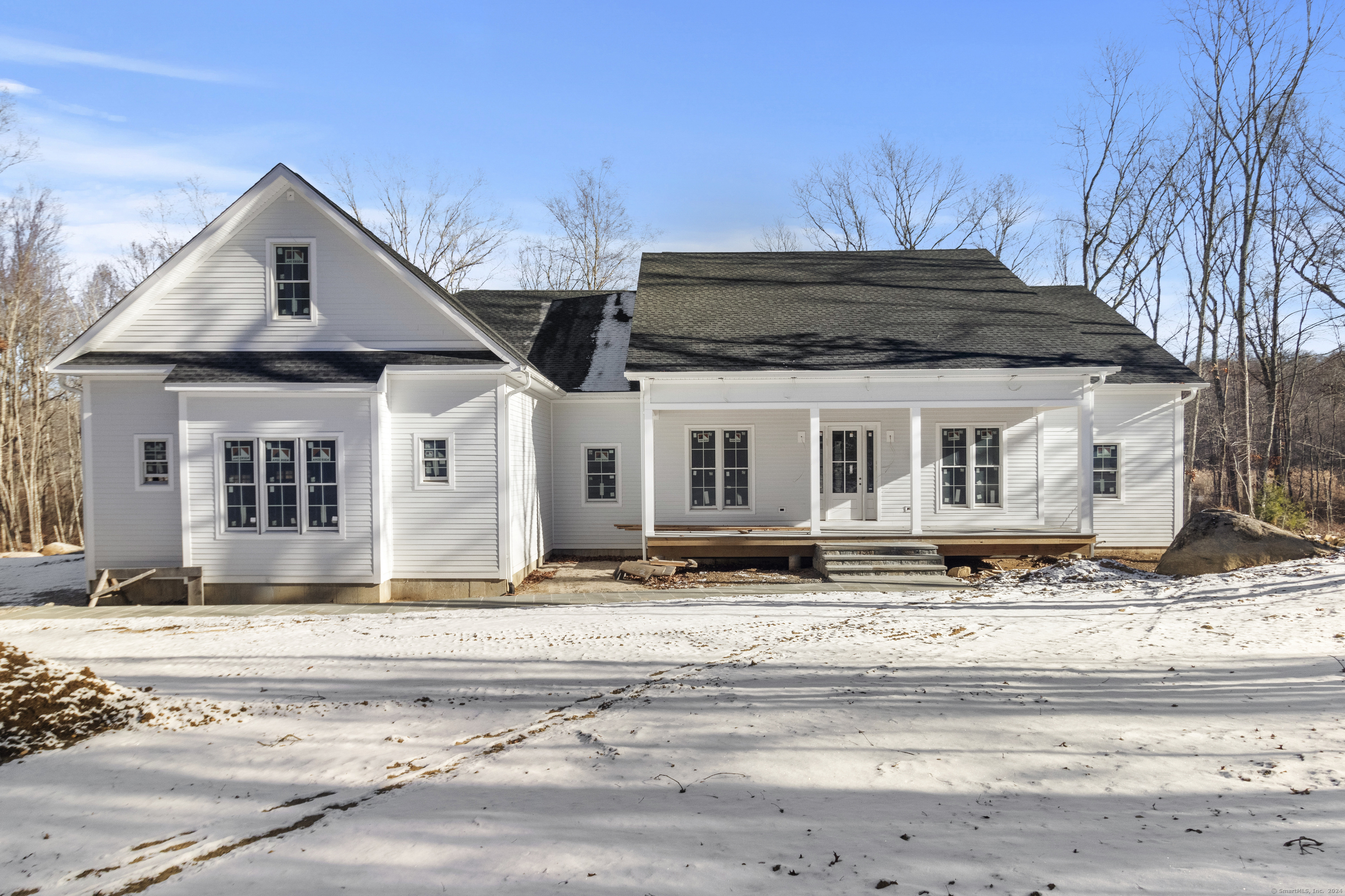 a view of a house with snow on the side of it