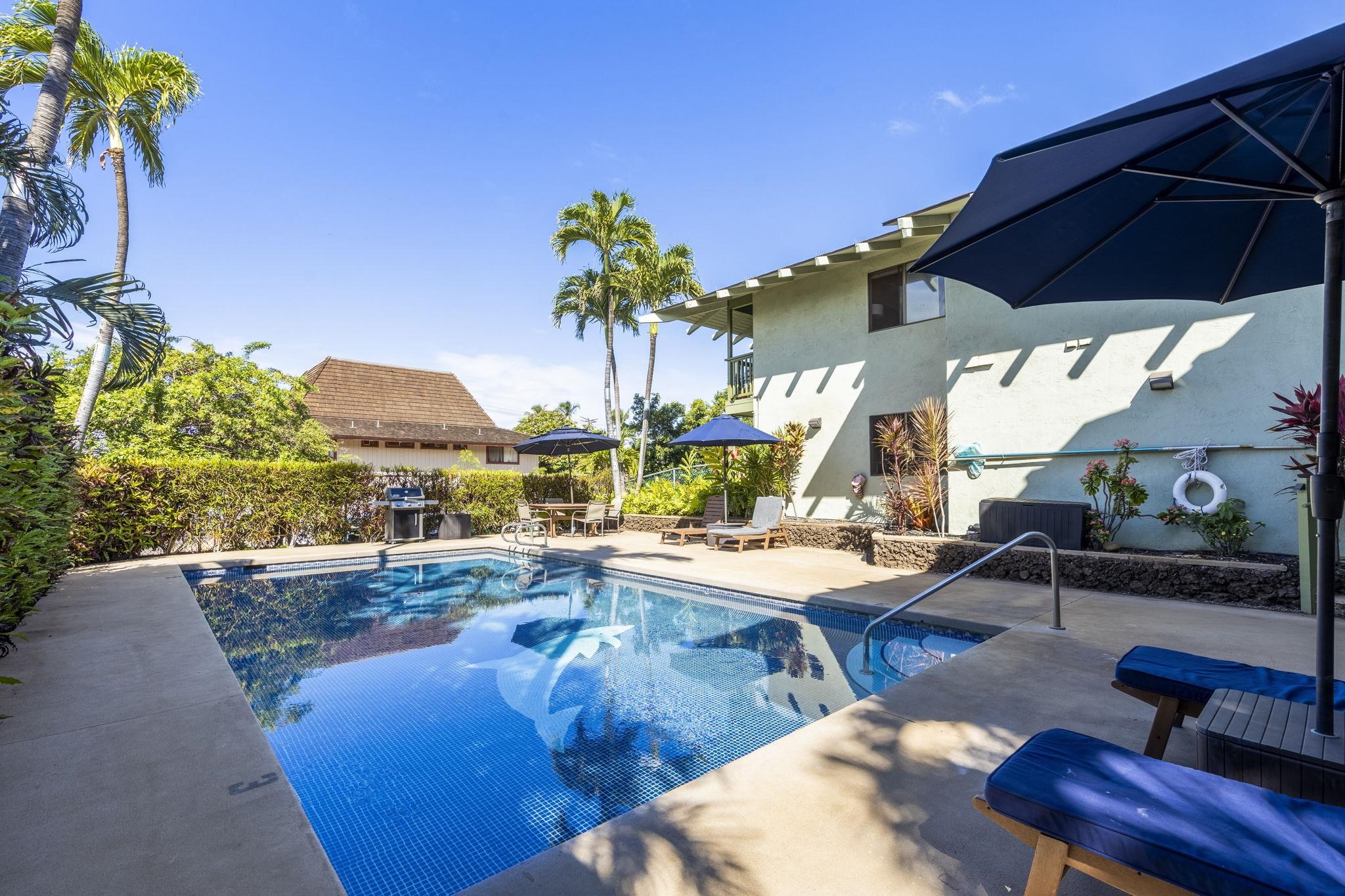 a view of swimming pool with outdoor seating