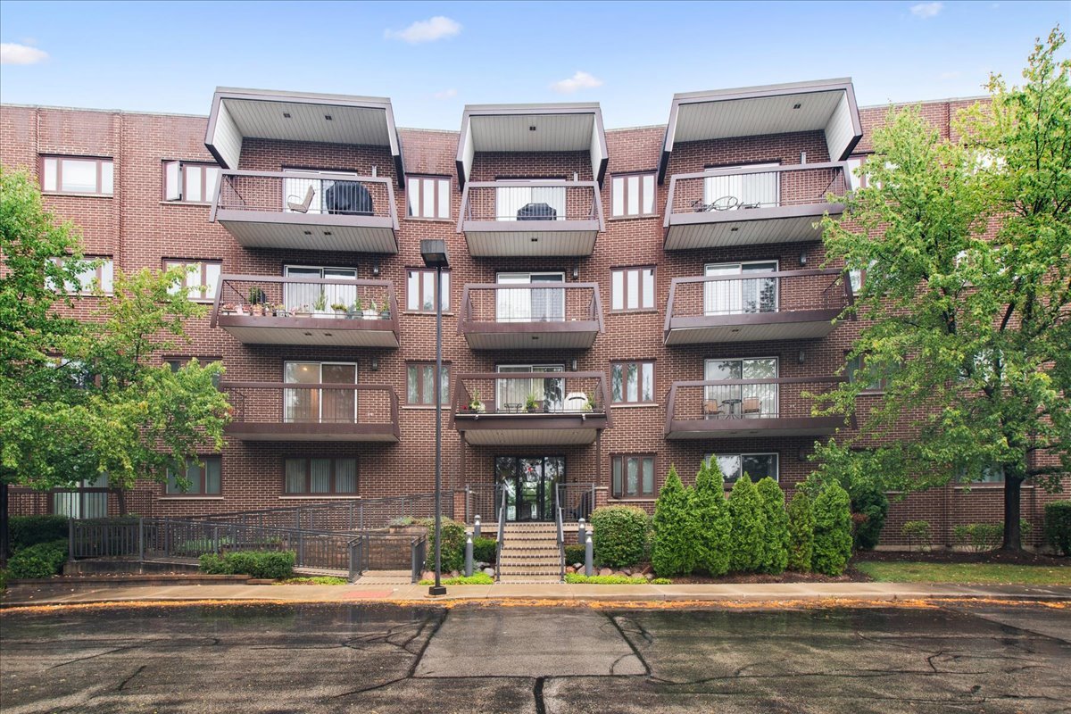 a front view of residential building with yard