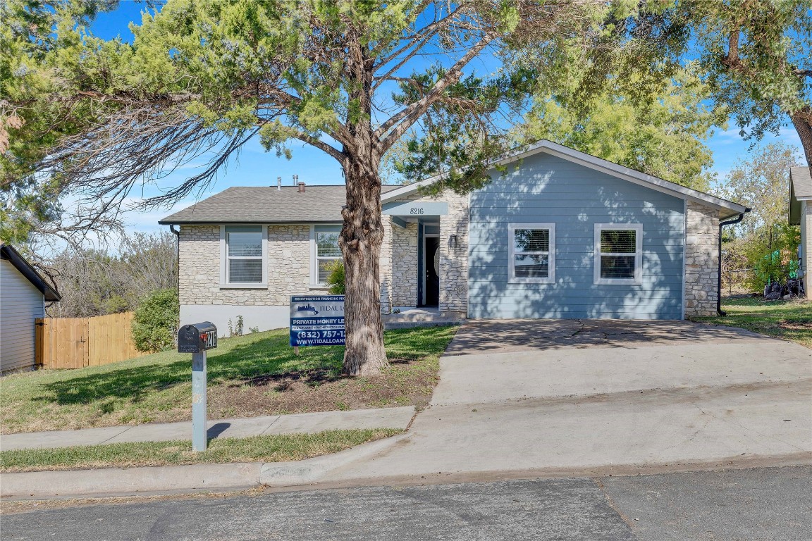 front view of a house with a small yard