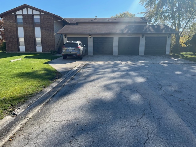 a view of house with yard