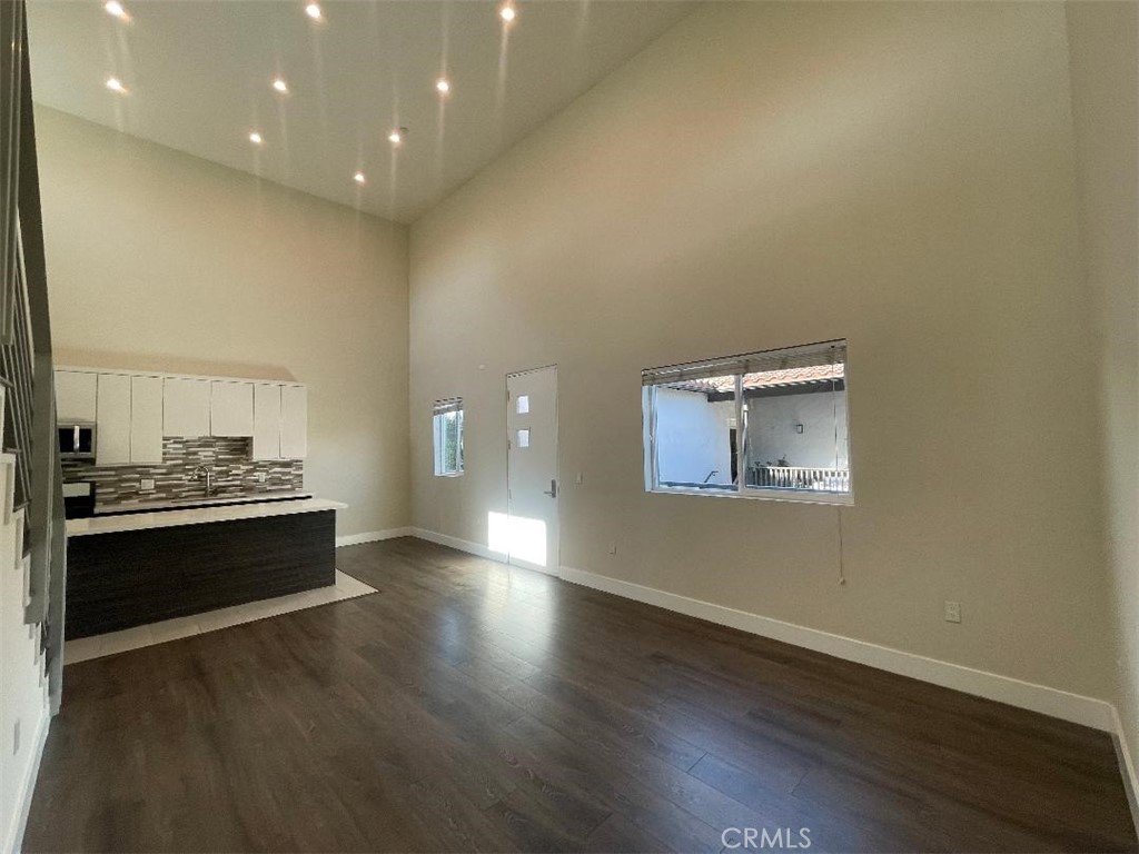 a room with a stove and wooden floor