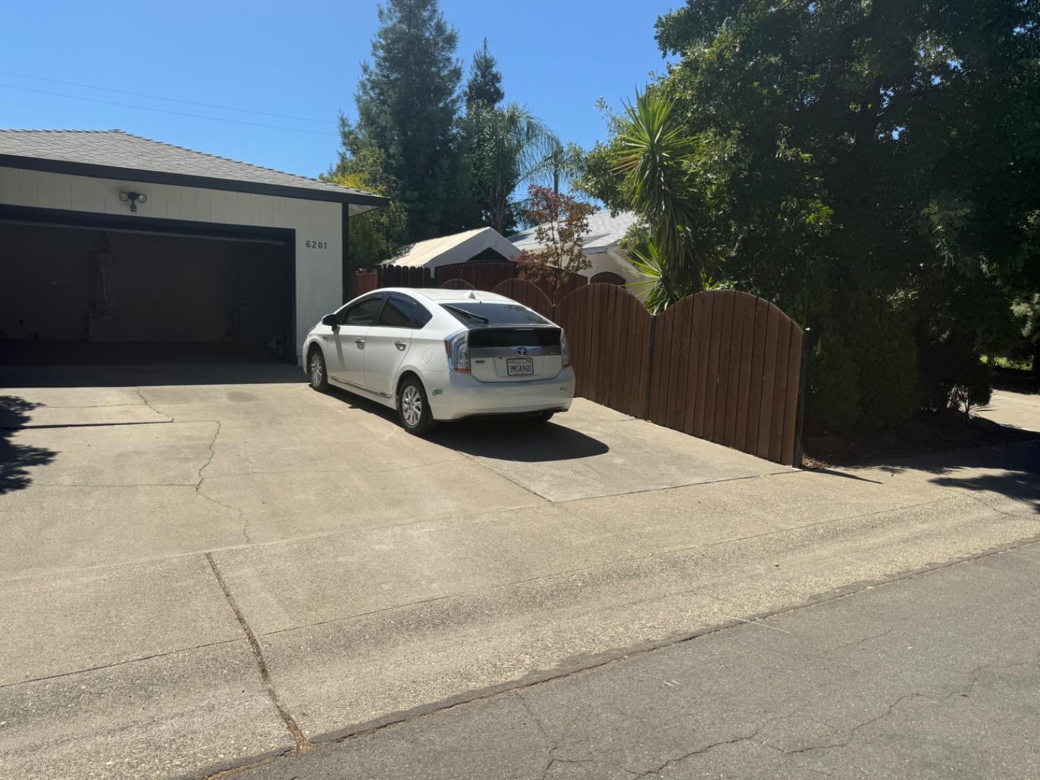 a car parked in front of a house