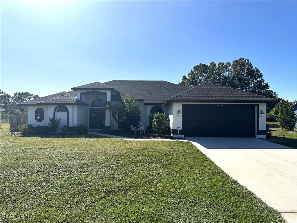 a front view of a house with yard