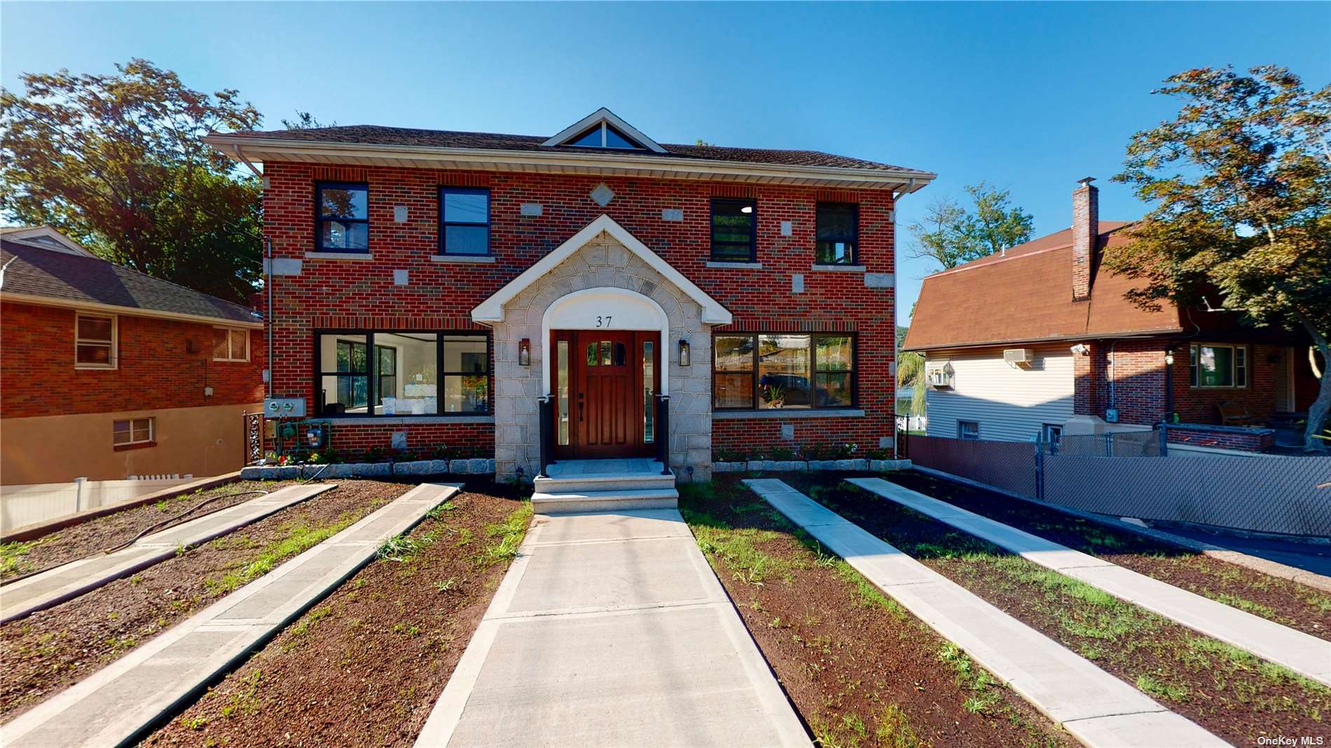 a front view of a house with a yard