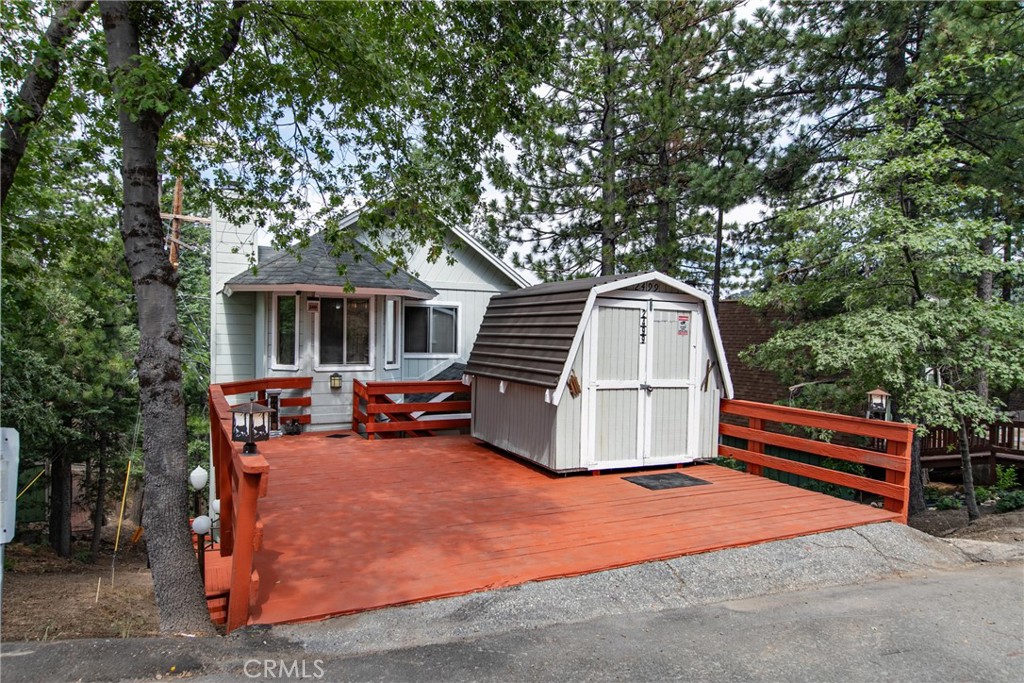 a backyard of a house with oven and barbeque oven