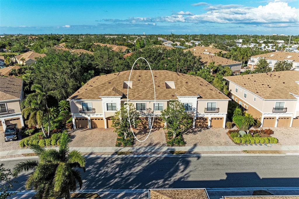 an aerial view of a house with a ocean view