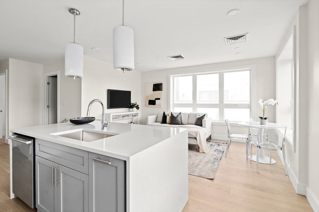 a view of living room with furniture and flat screen tv