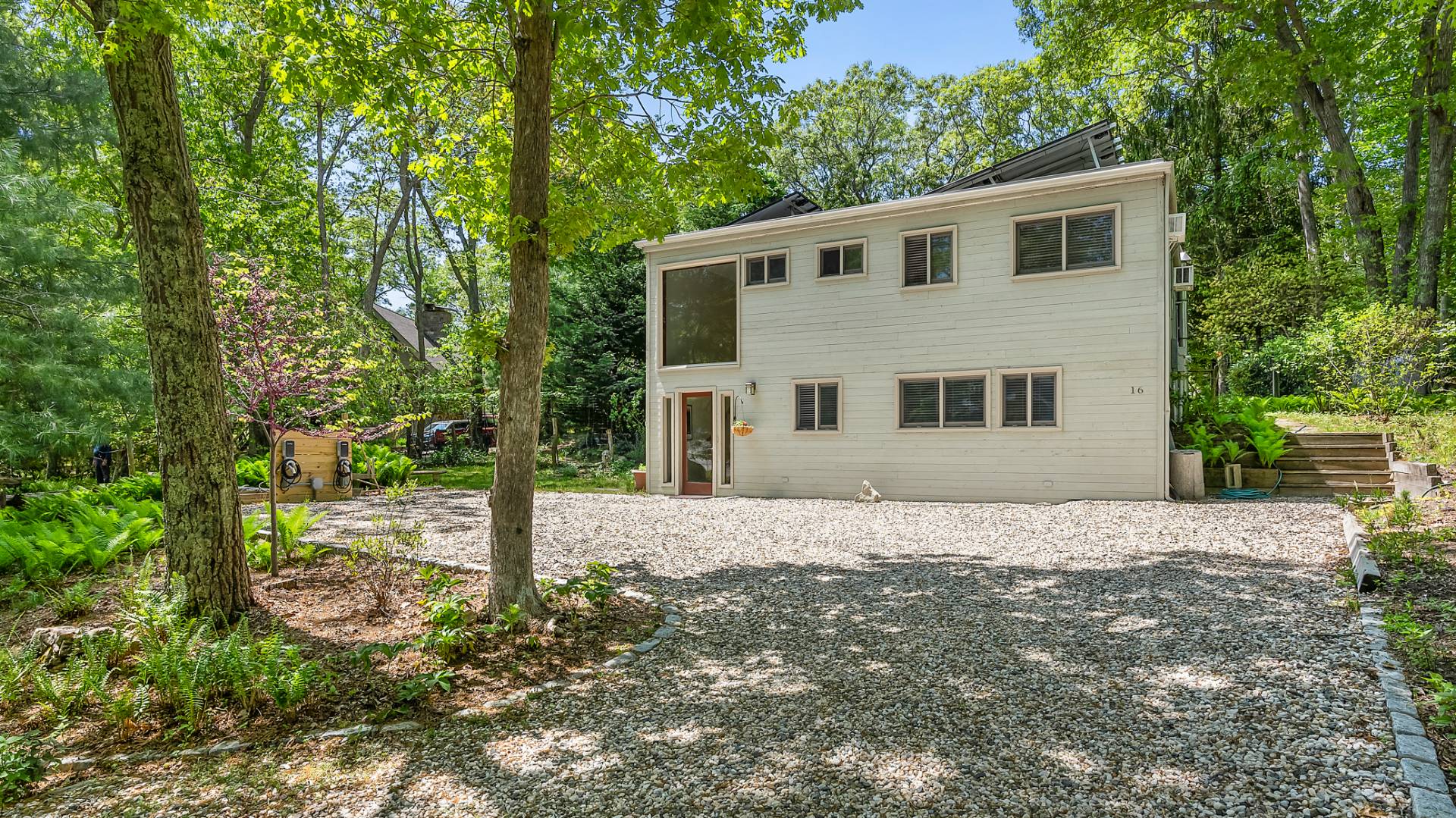 a house that has a tree in front of it