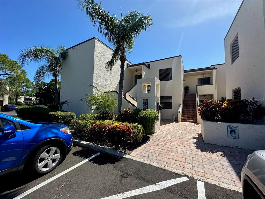 a front view of a house with parking space