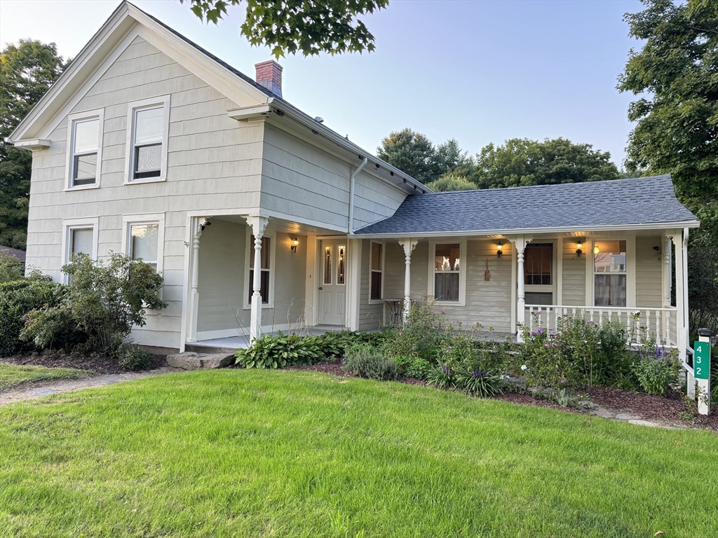 a view of a house with garden and yard