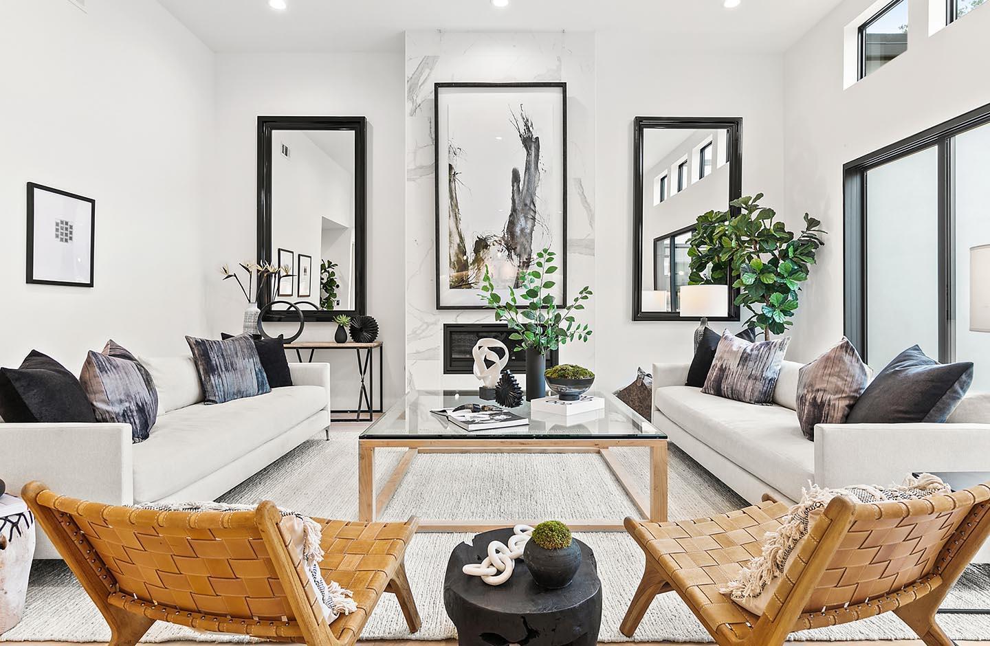 a living room with furniture and a mirror