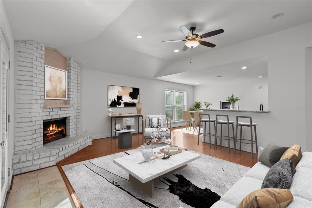 Open concept floor plan w/ breakfast bar and dining open to living. ( virtually staged)