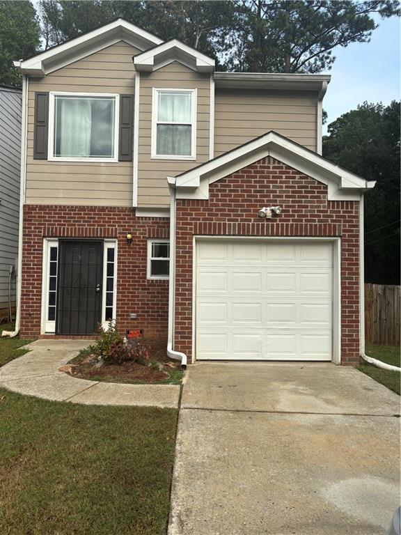 a front view of a house with a garage