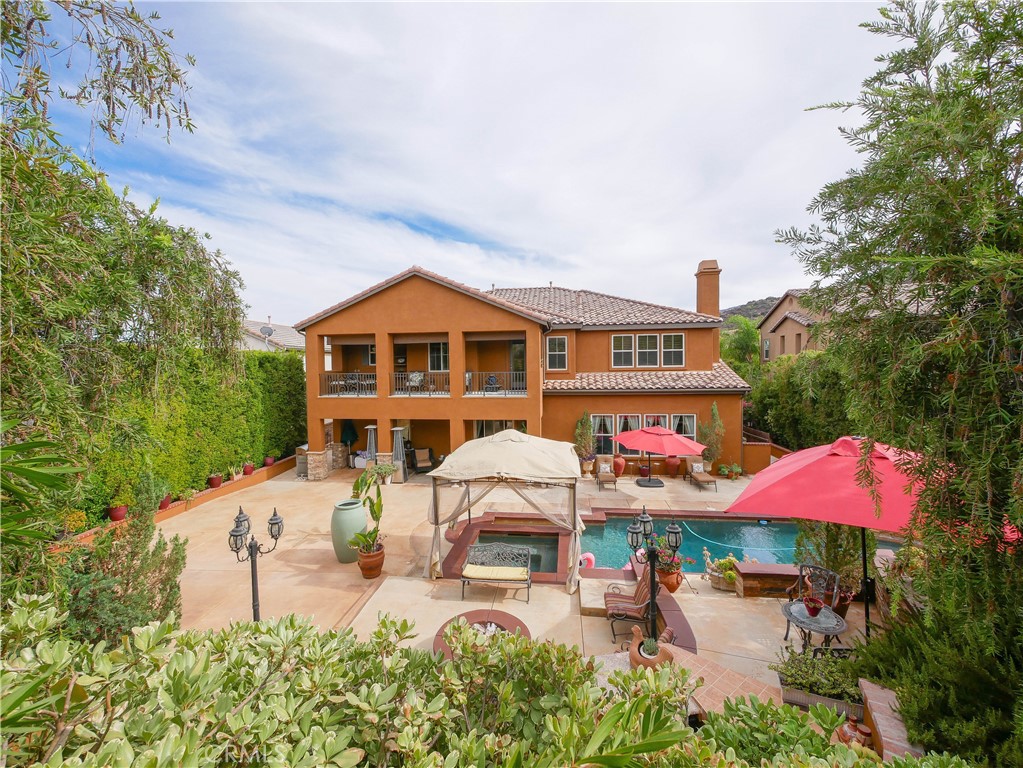 an outdoor space with pool and furniture