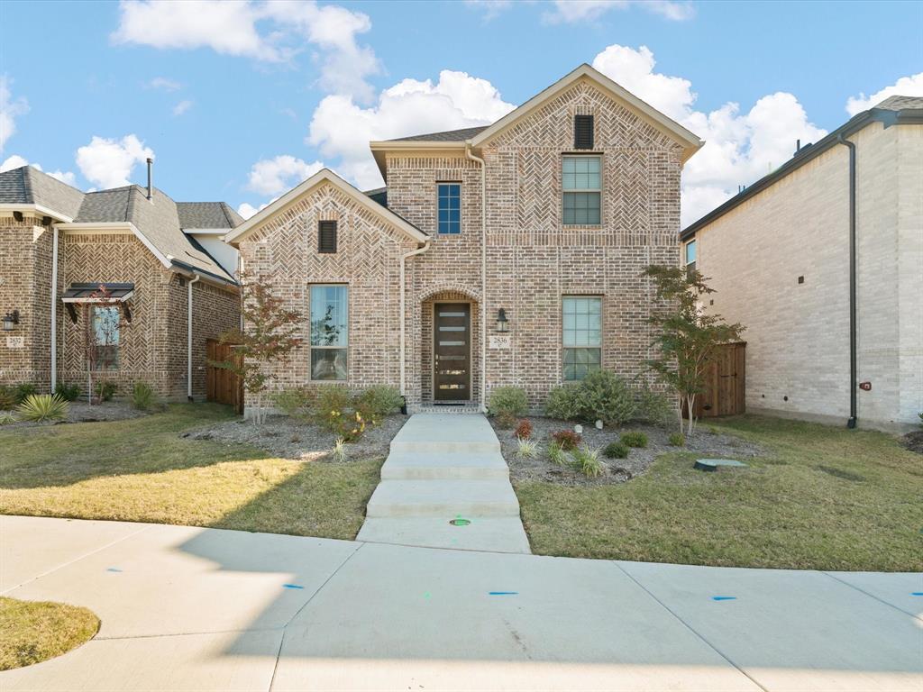 a front view of a house with yard