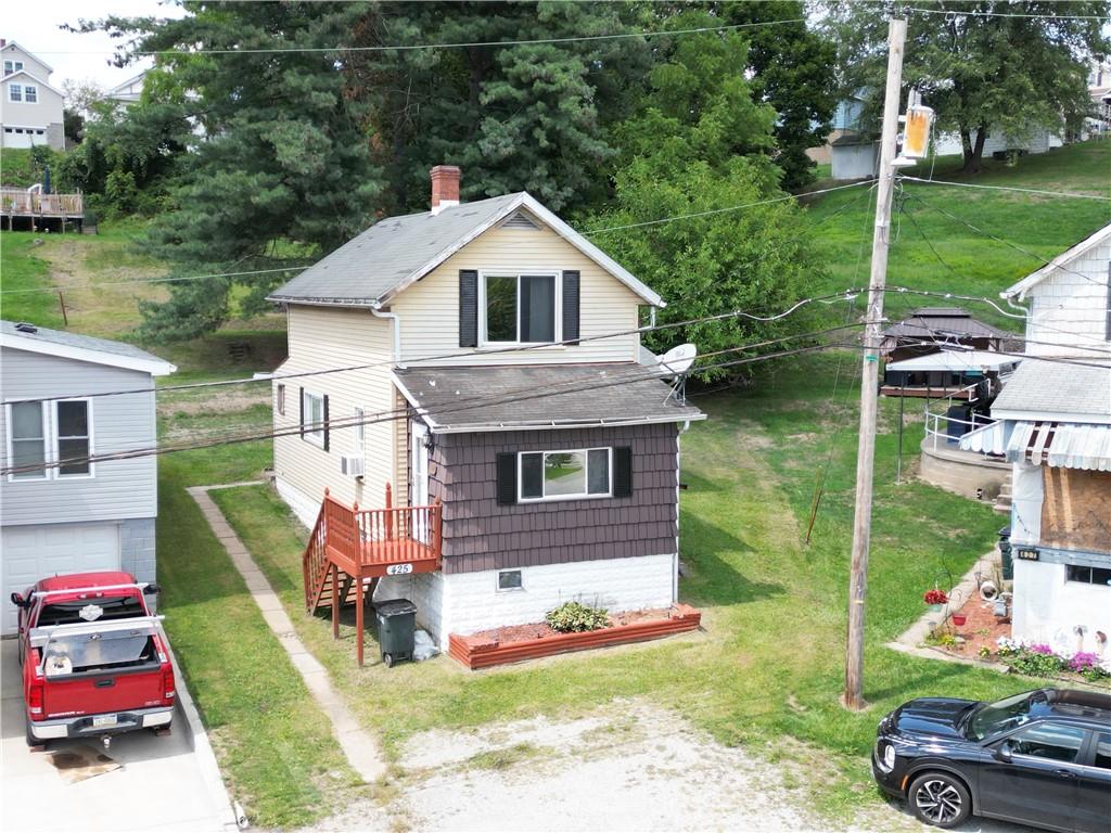 a aerial view of a house with garden