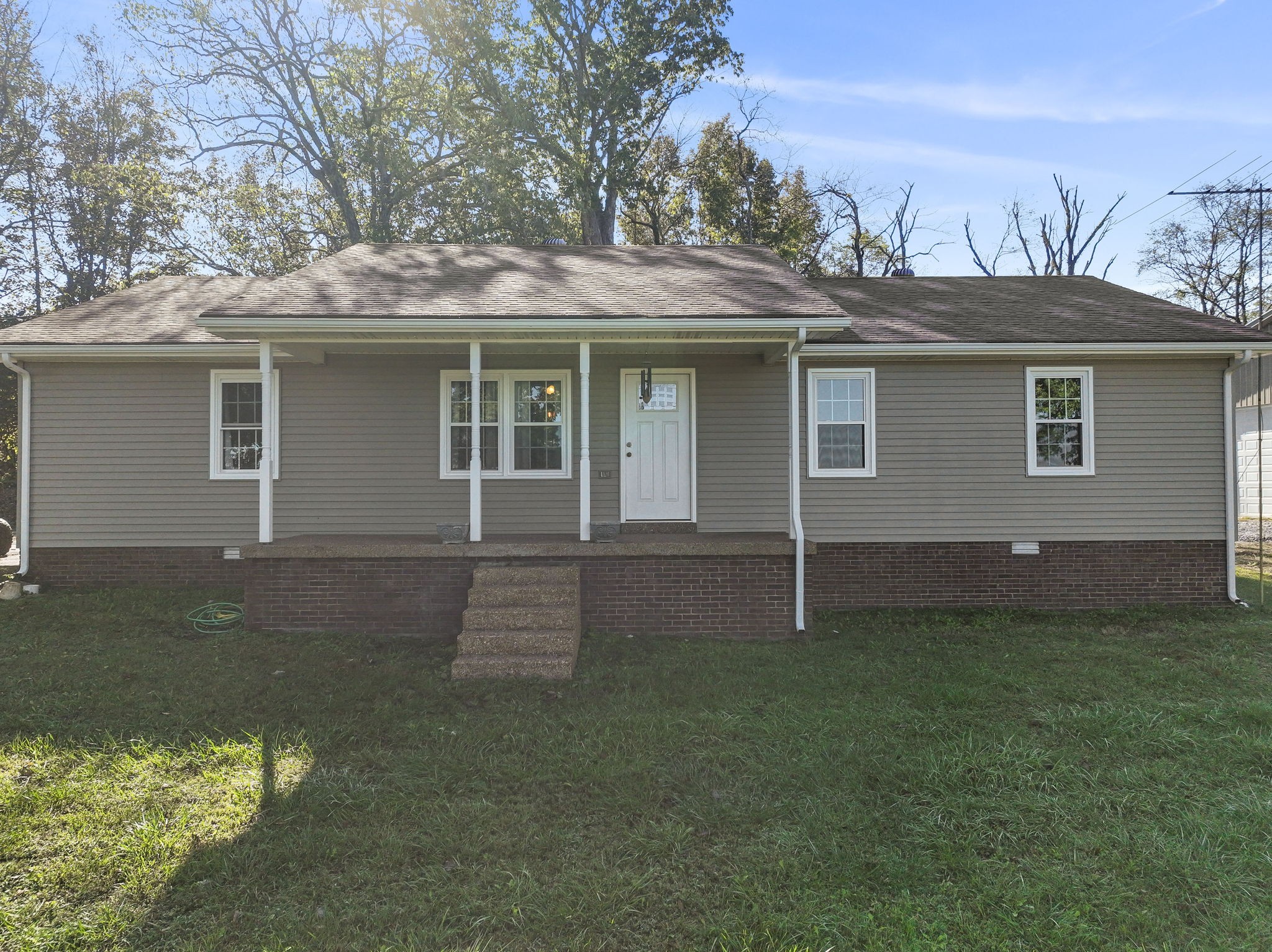 front view of a house with a yard