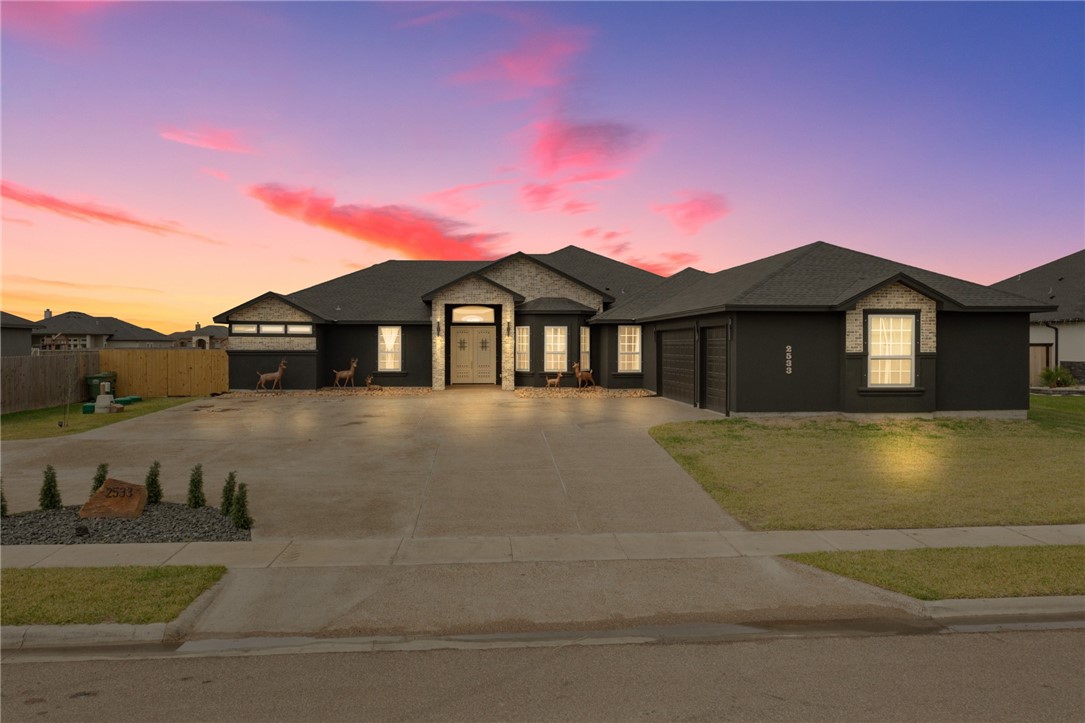 a front view of a house with a yard