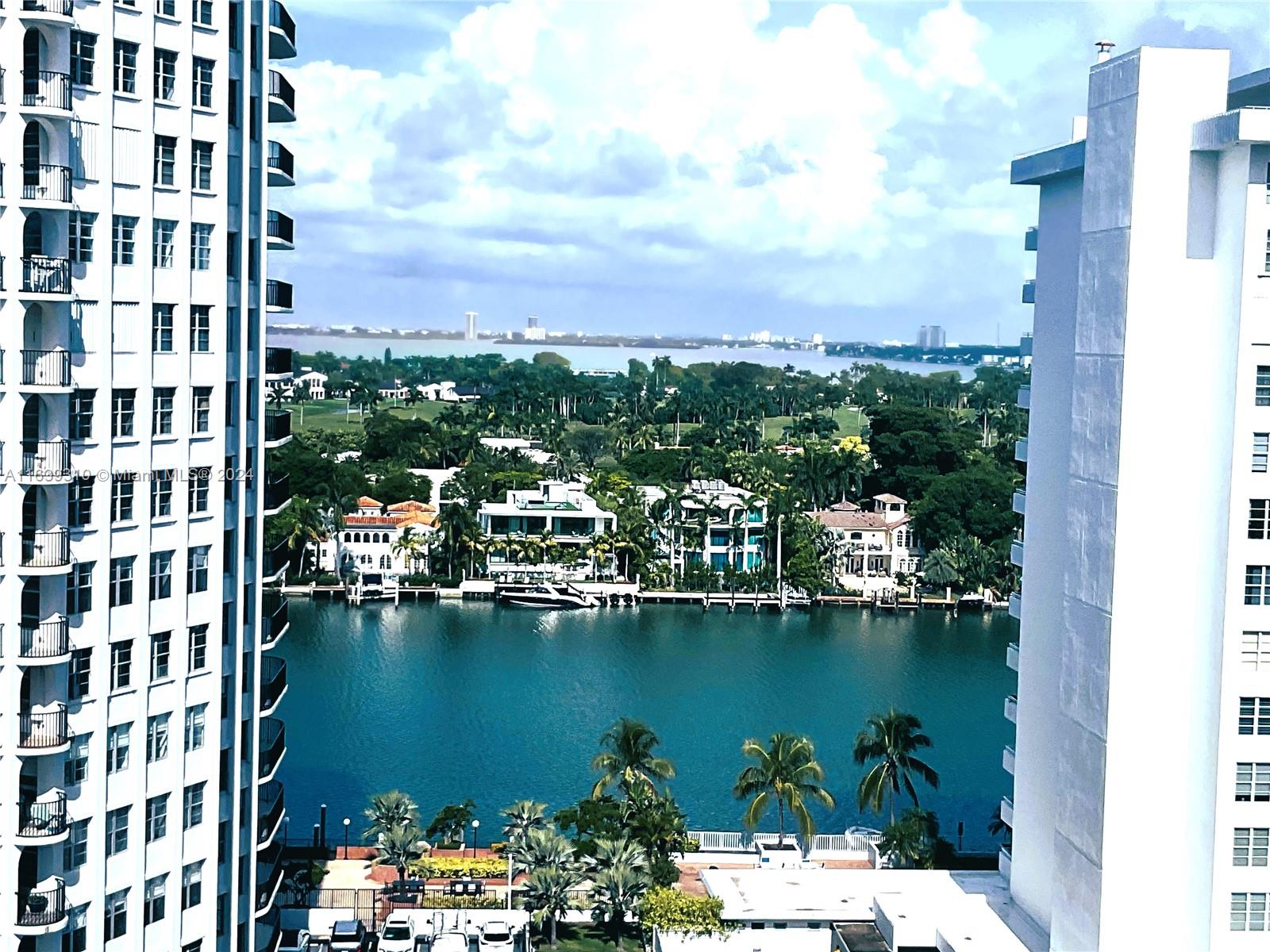 a view of a lake with tall buildings