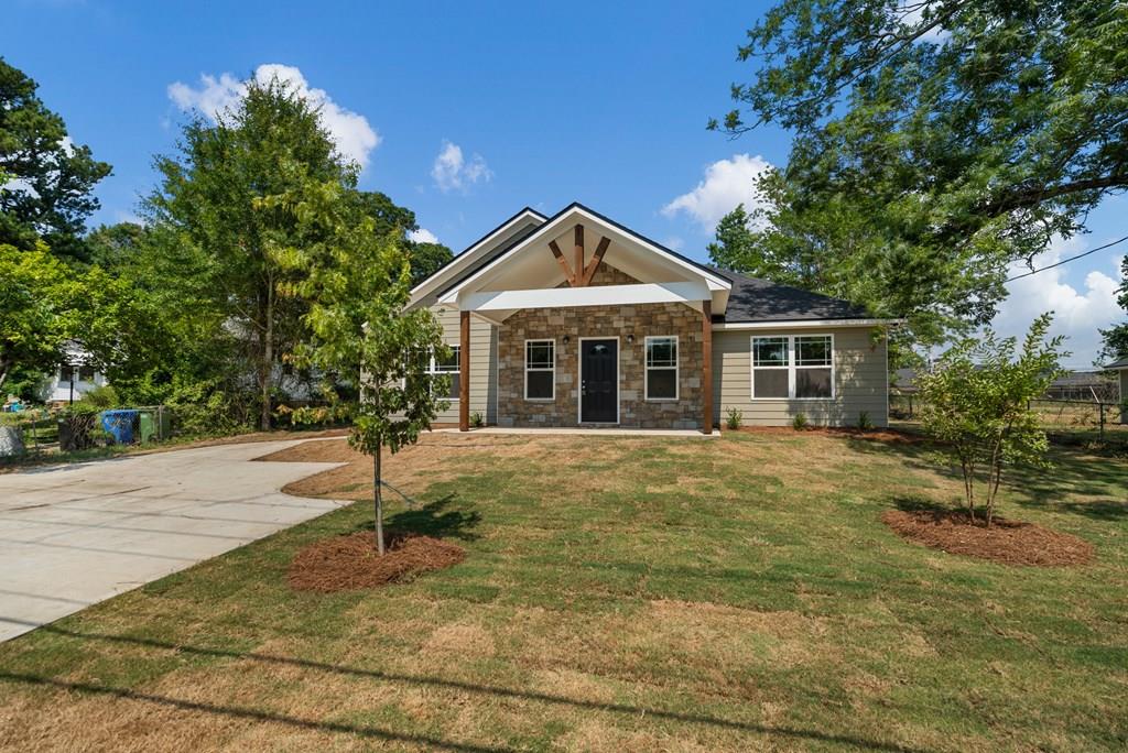 a front view of a house with a yard