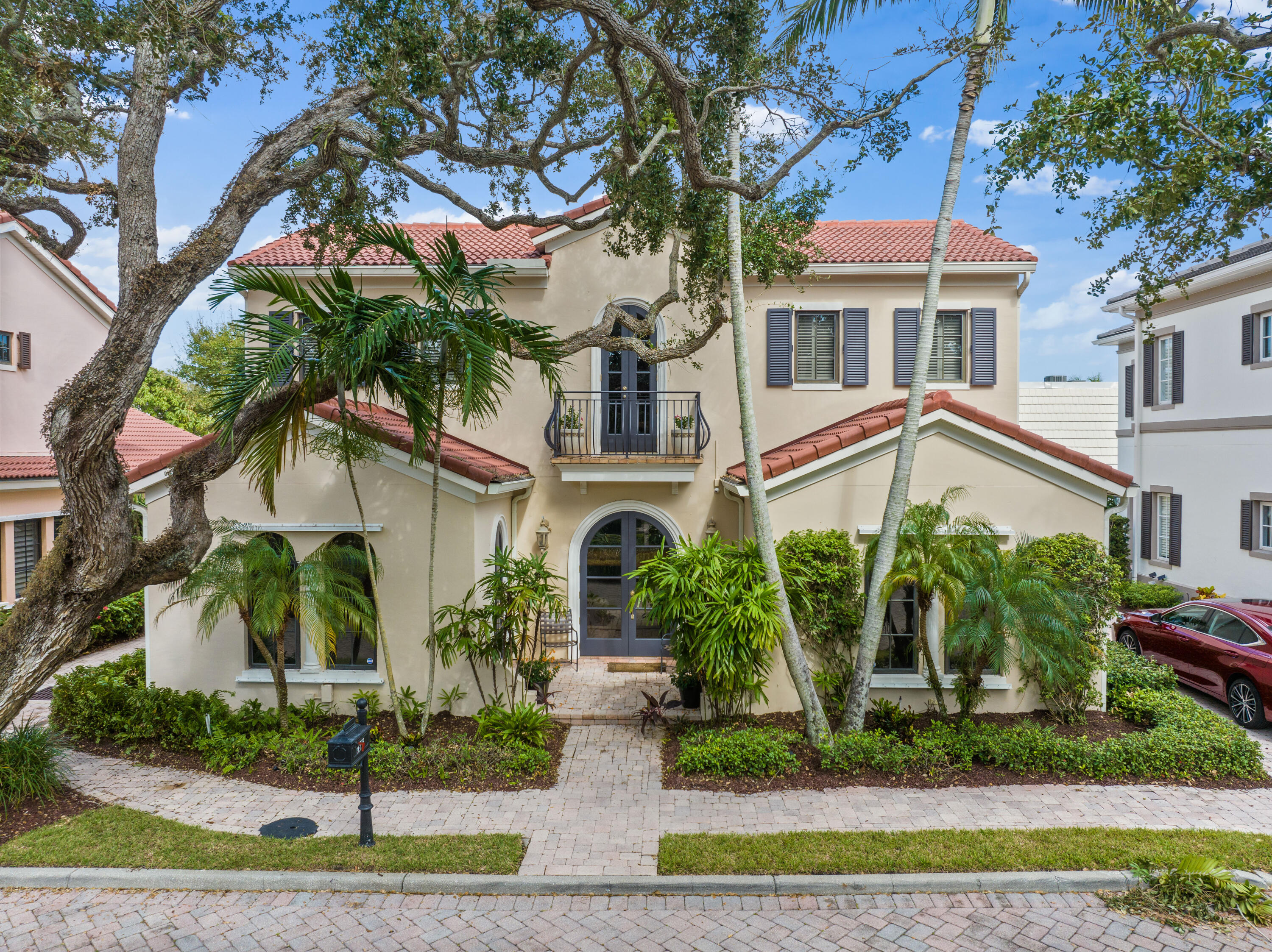 a front view of a residential houses with yard