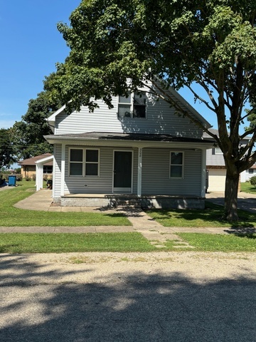 a view of a house with swimming pool and a yard