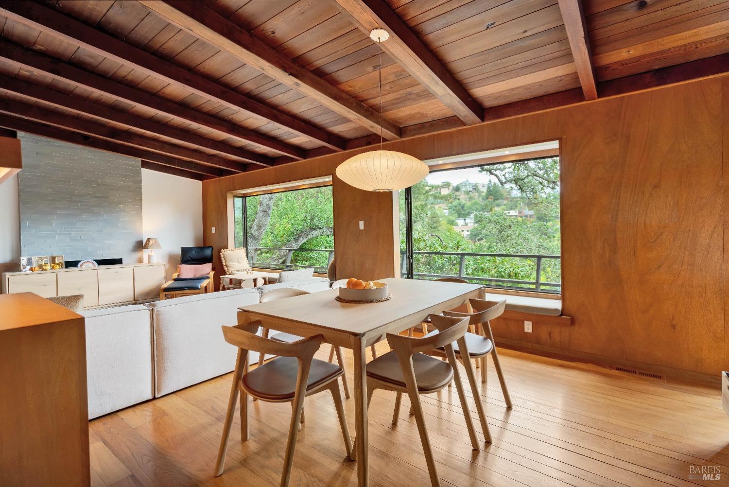 a view of a dining room with furniture window and outside view