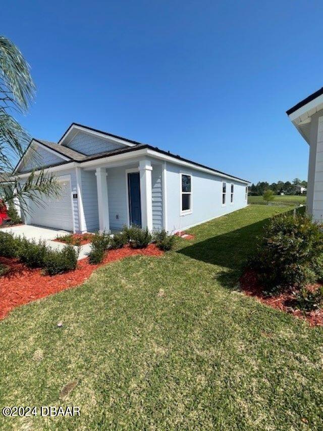 a view of a house with a backyard