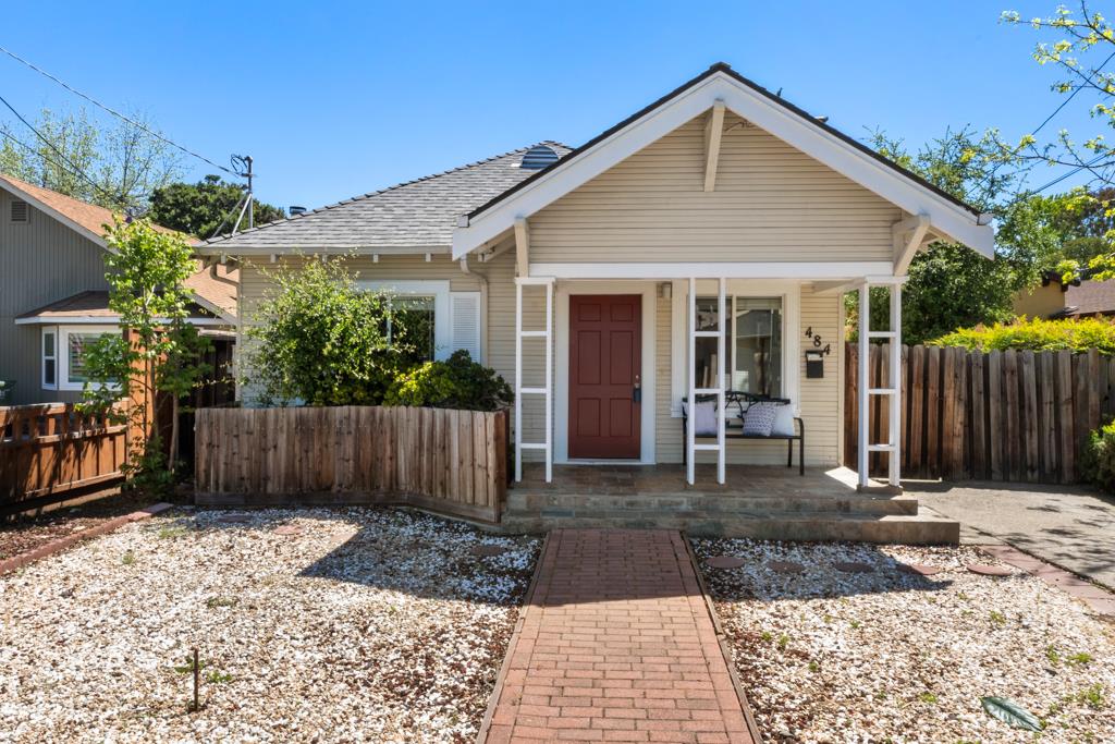 a front view of house with yard and outdoor seating