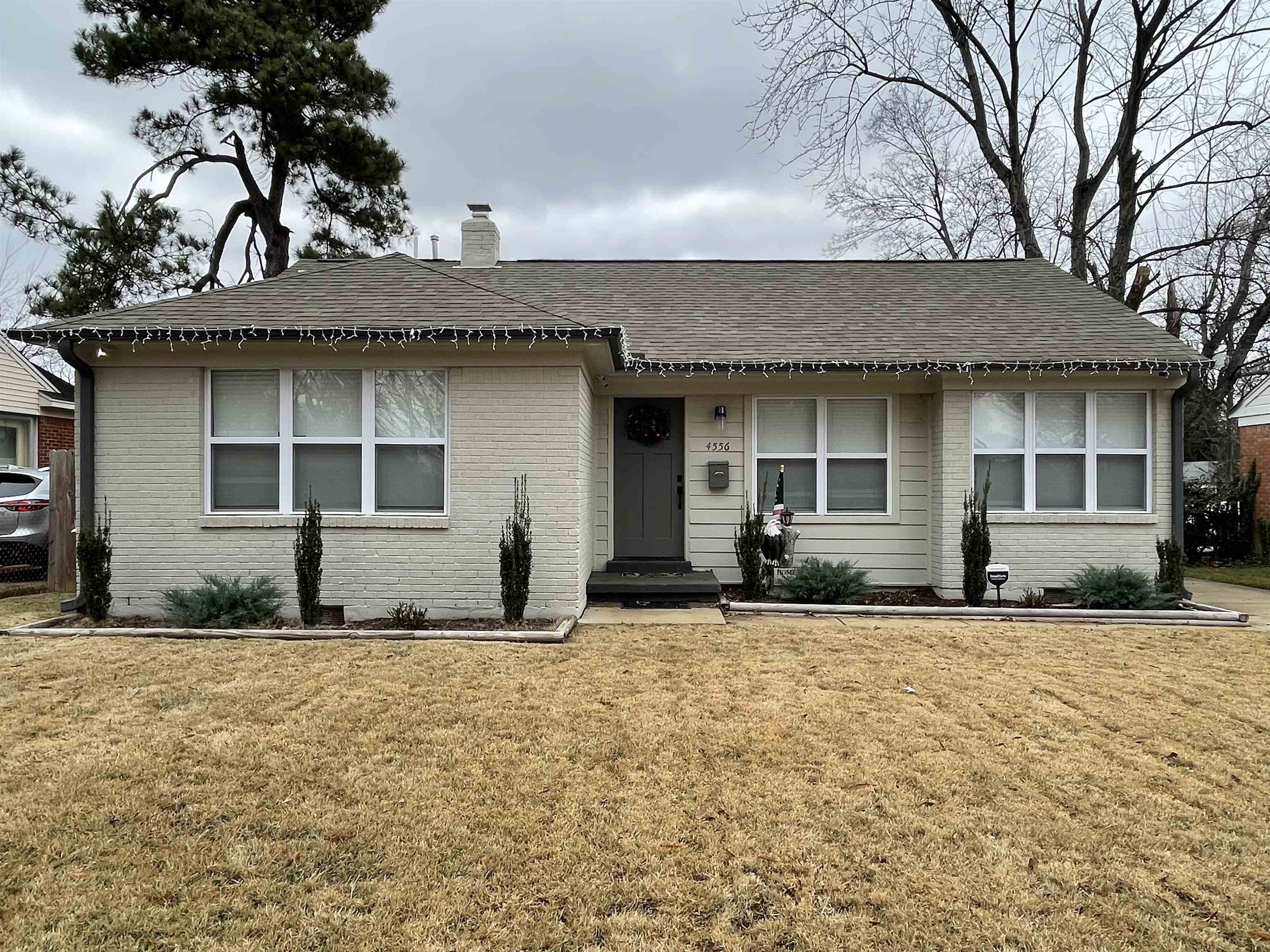 a front view of a house with a yard