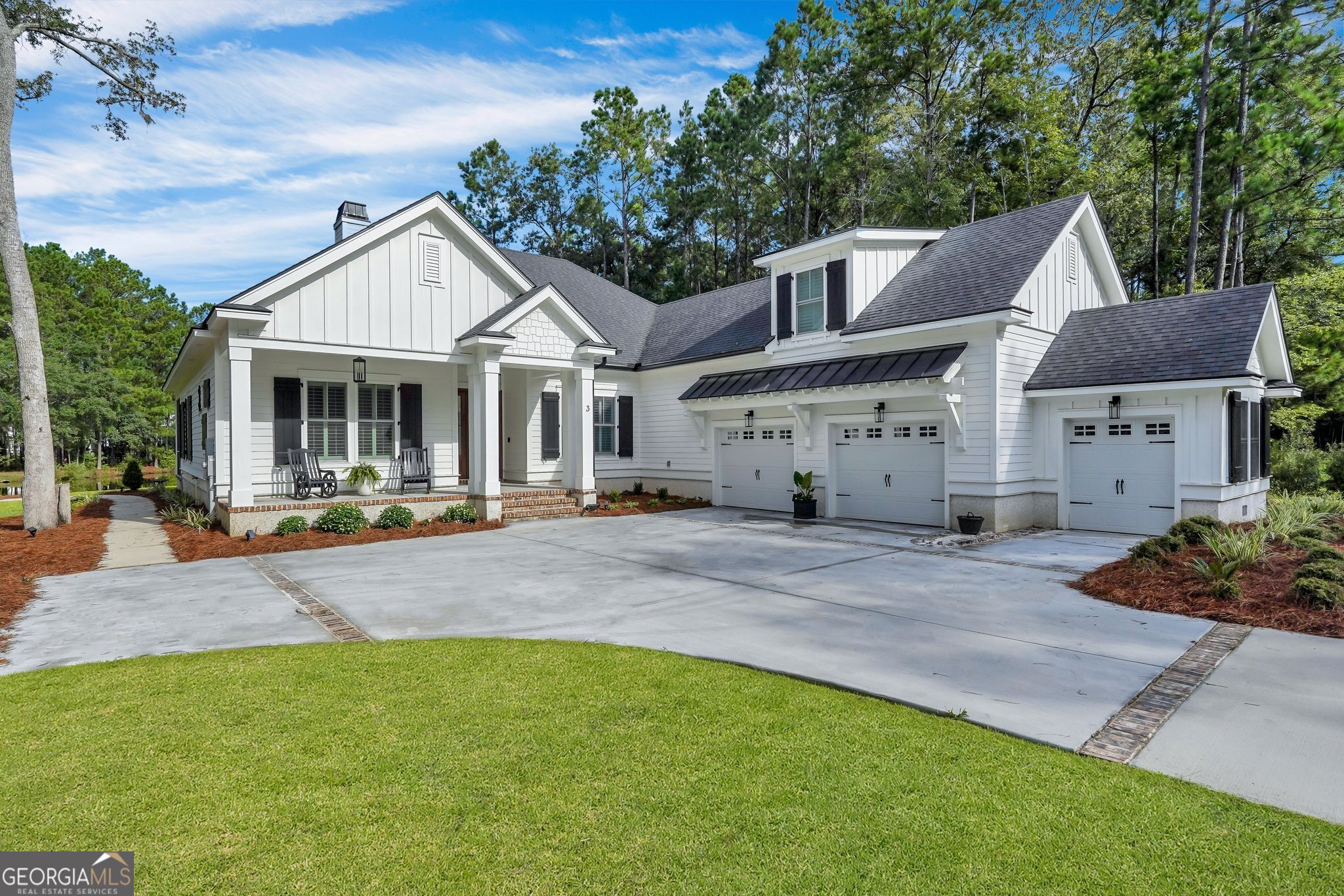 a view of a house with backyard and a tree