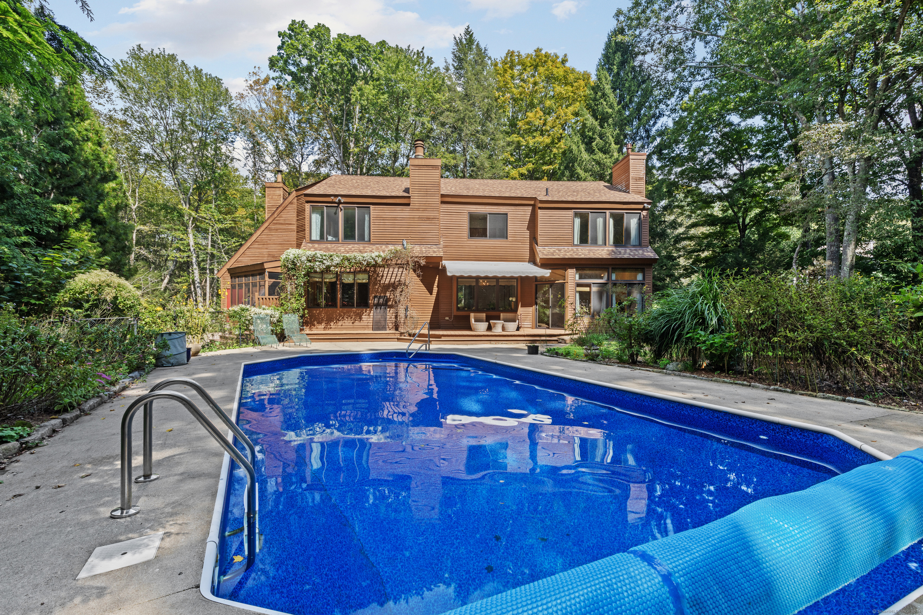 a view of a house with swimming pool