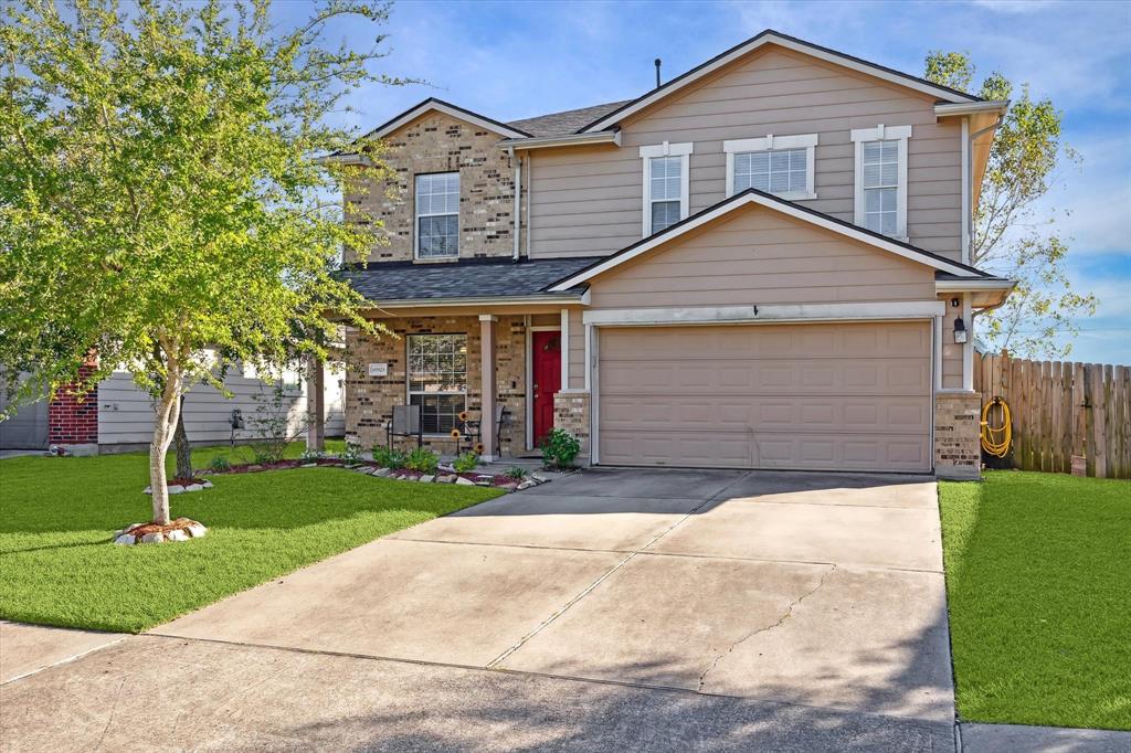 Welcome to 10925 Groveshire Drive. The house has a front porch for you to sit and relax.