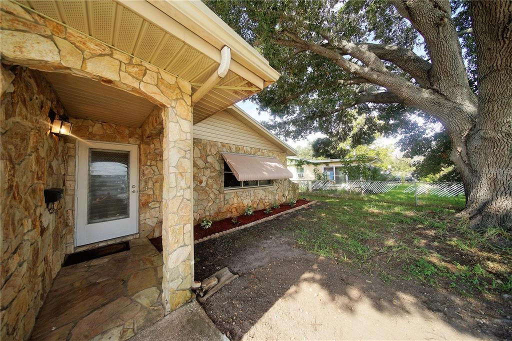 a view of a back yard of the house