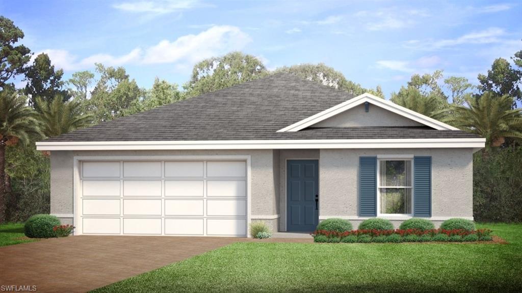 View of front of house with a garage and a front yard