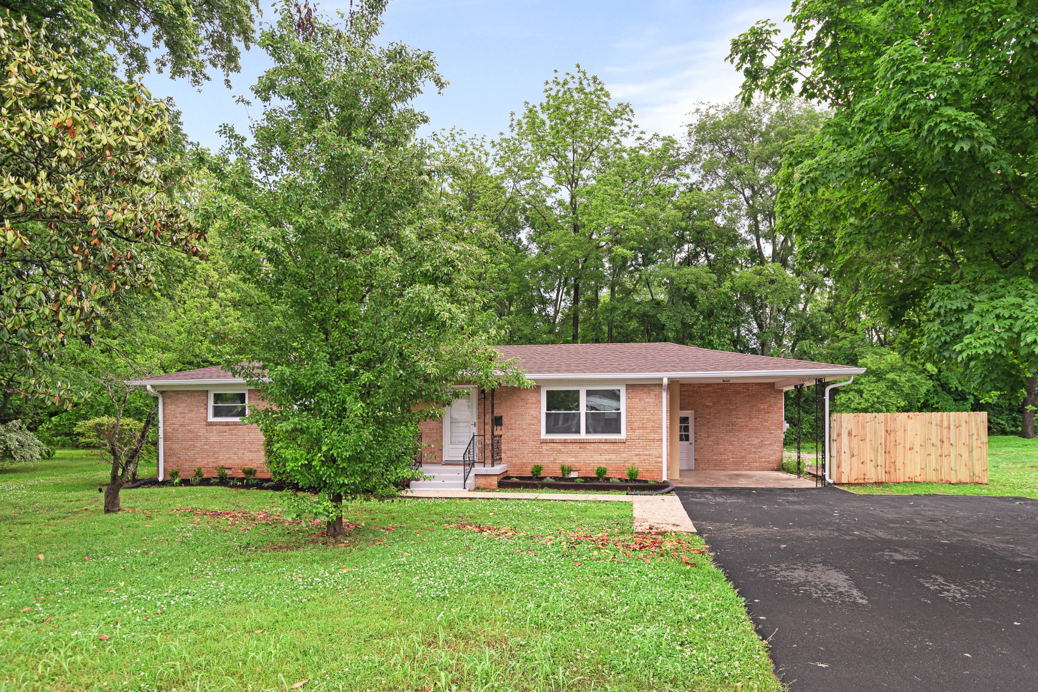 front view of a house with a yard