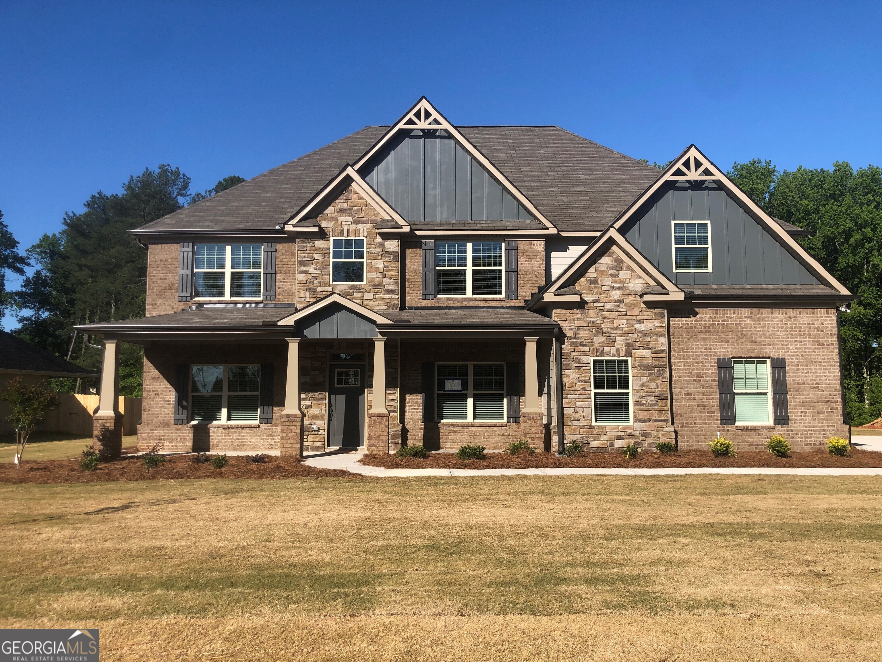 a front view of a house with a porch