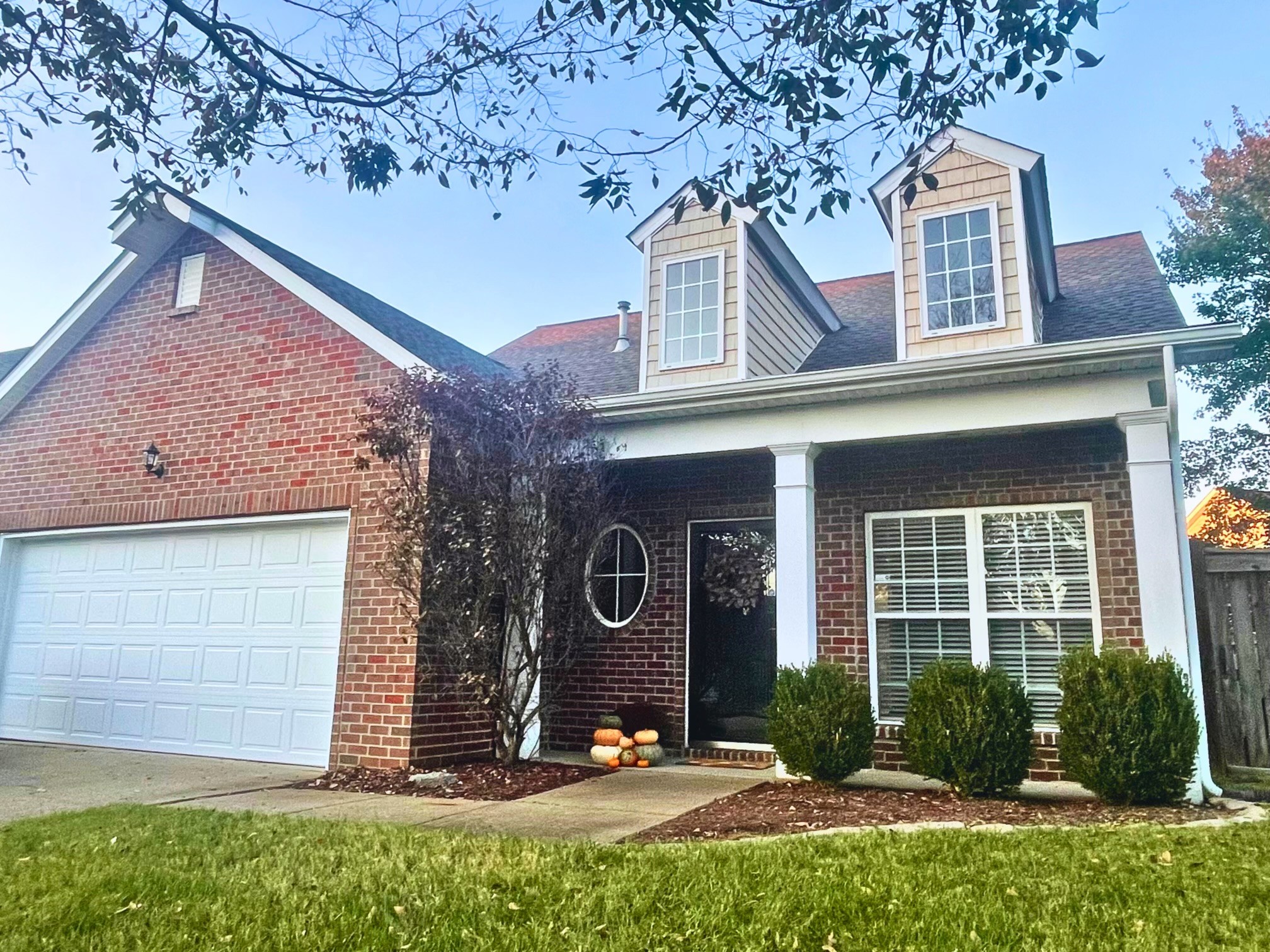 front view of a house with a yard