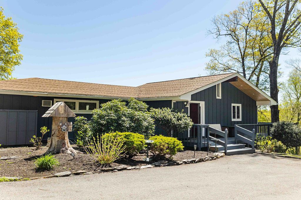 a front view of a house with garden