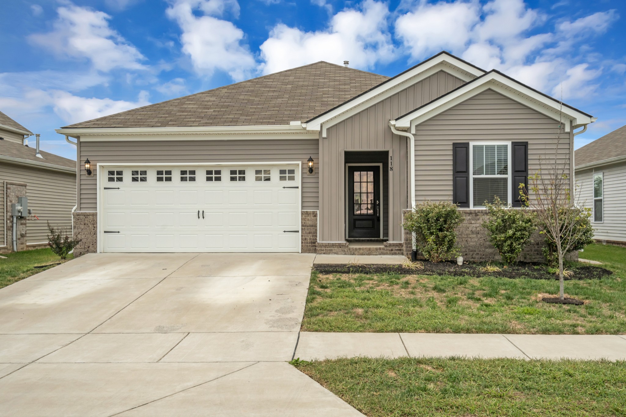 a front view of a house with a yard