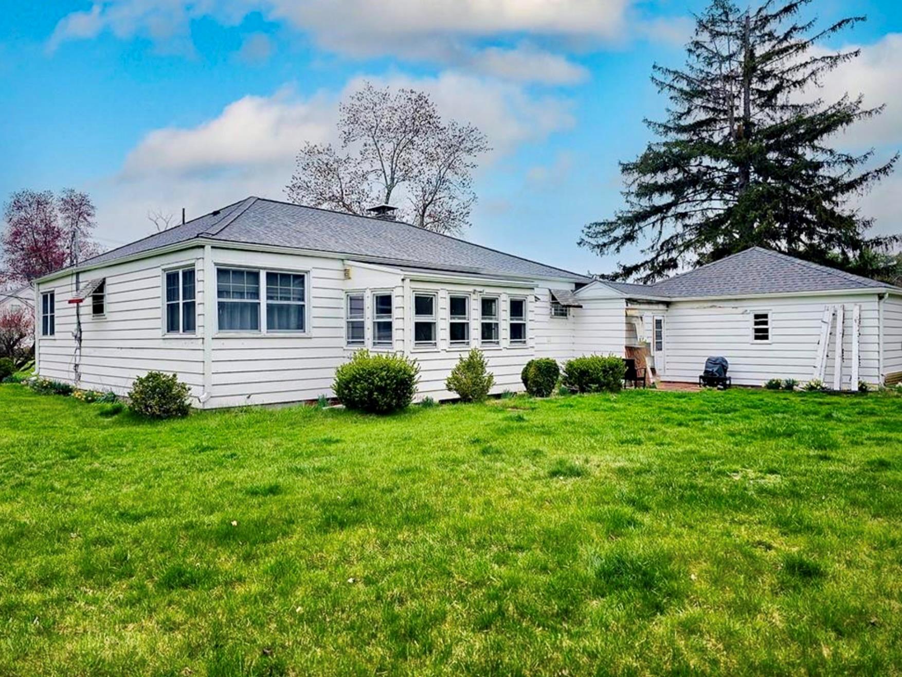 a front view of a house with a yard