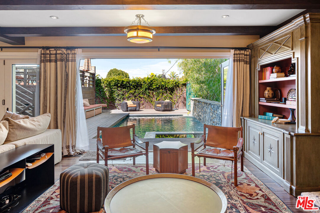 a outdoor living space with furniture and a potted plant