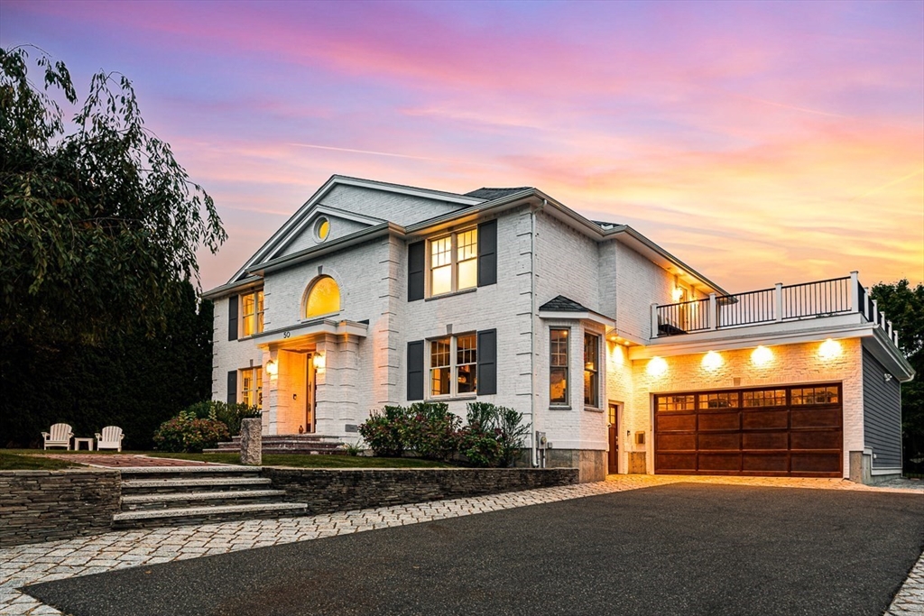 a front view of a house with a garage