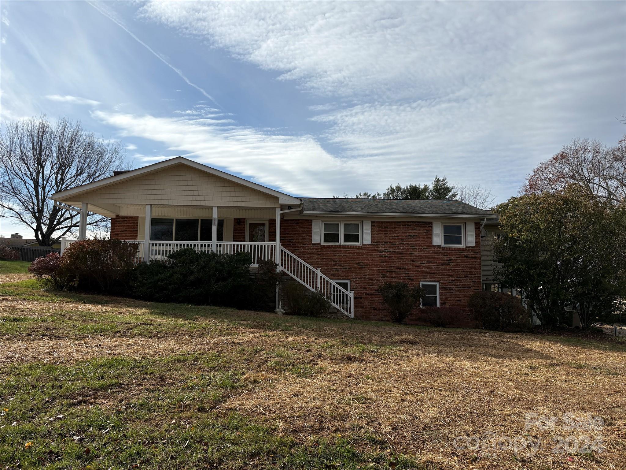 a view of a house with a yard