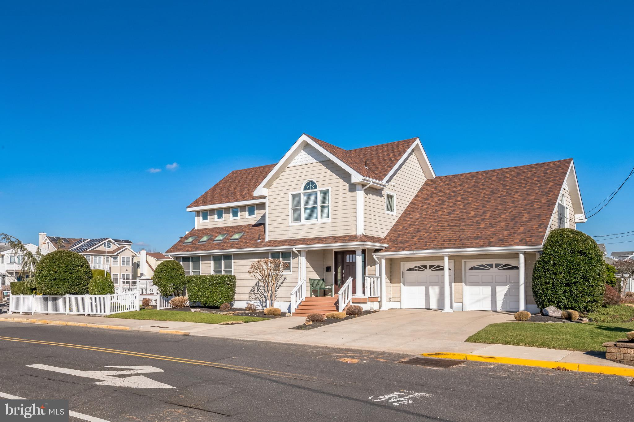 a view of a house with a yard and garage