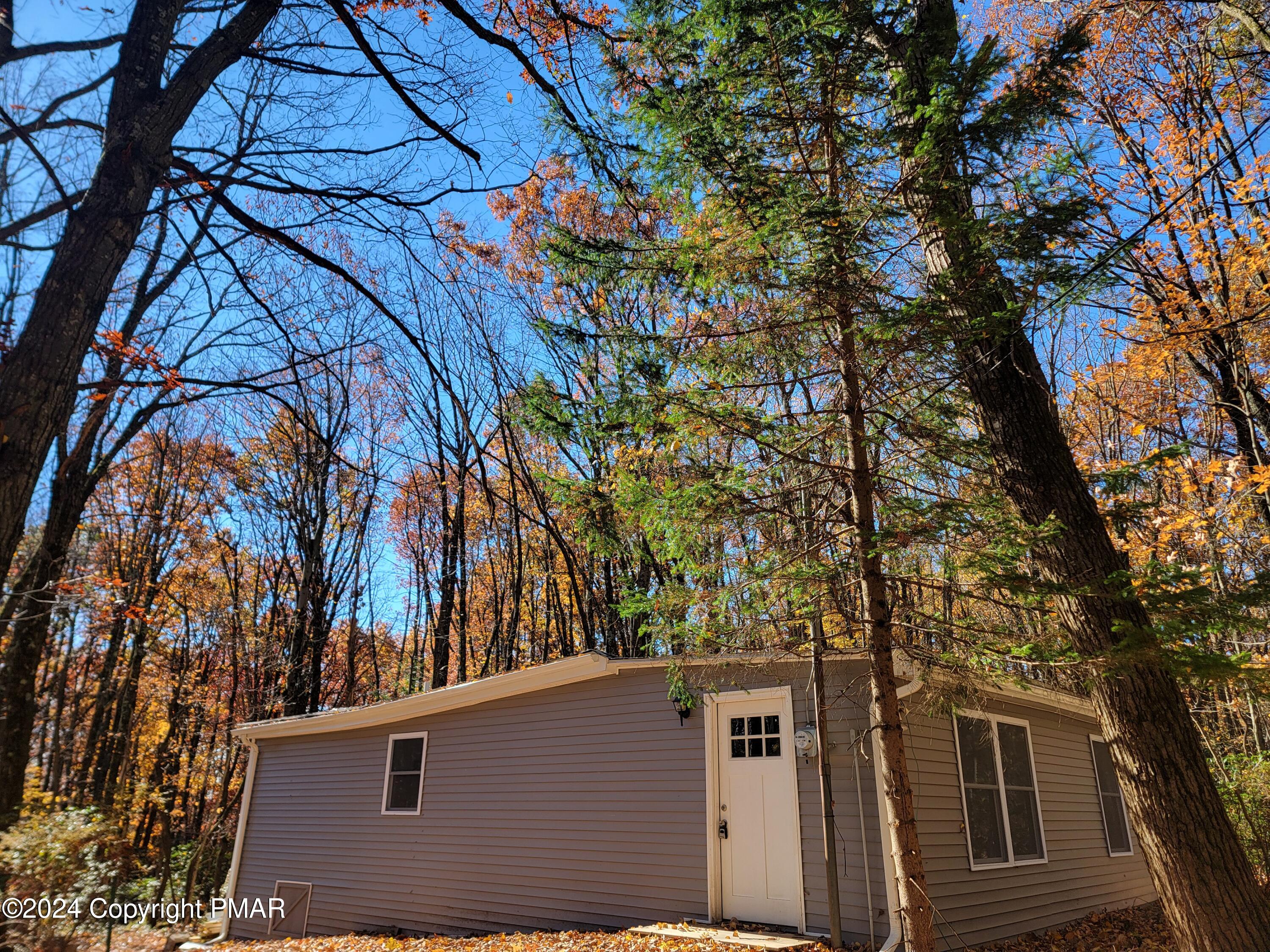 a view of a house with a tree