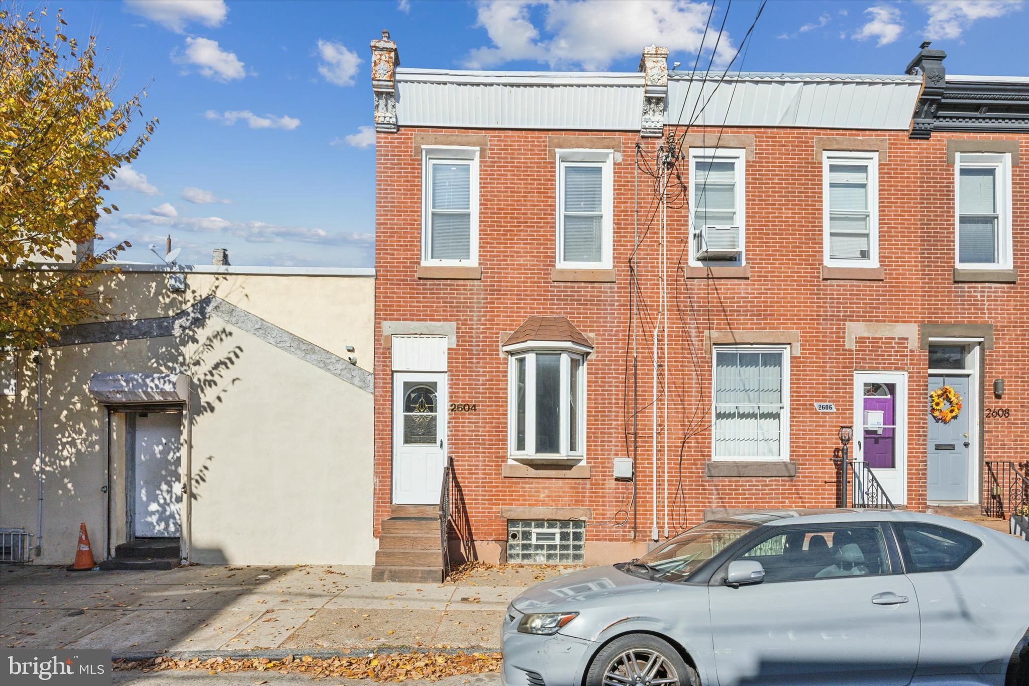 a front view of a house with parking space