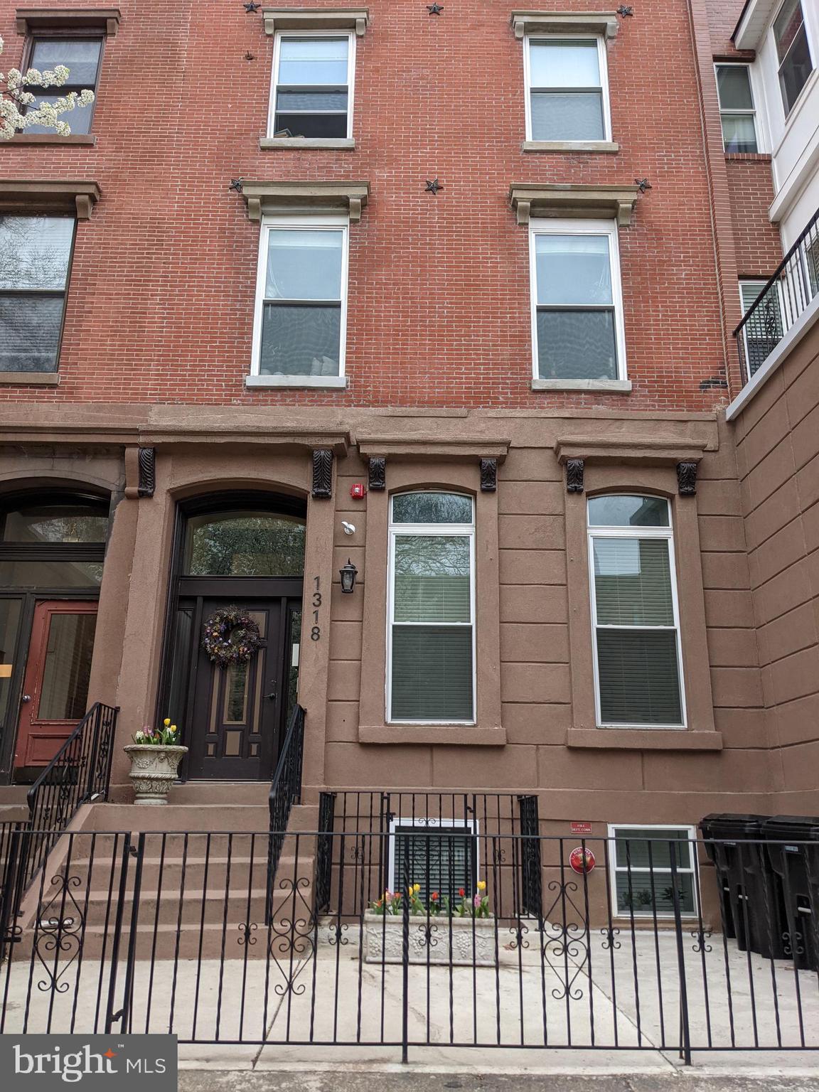 a view of a brick building with many windows