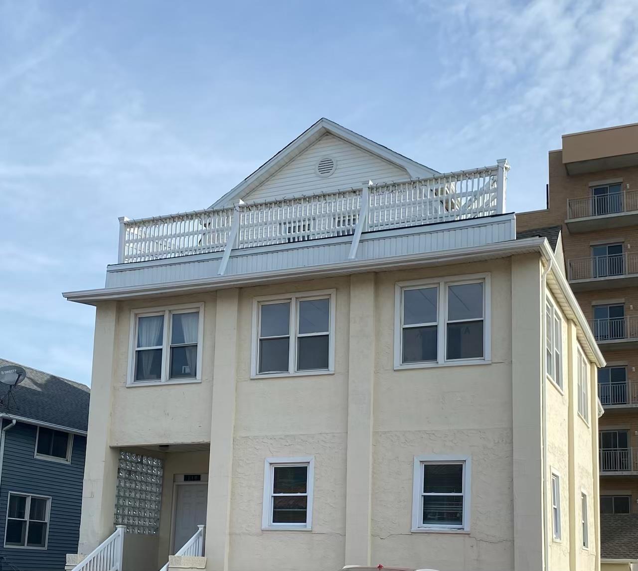 a view of a house with a window and balcony